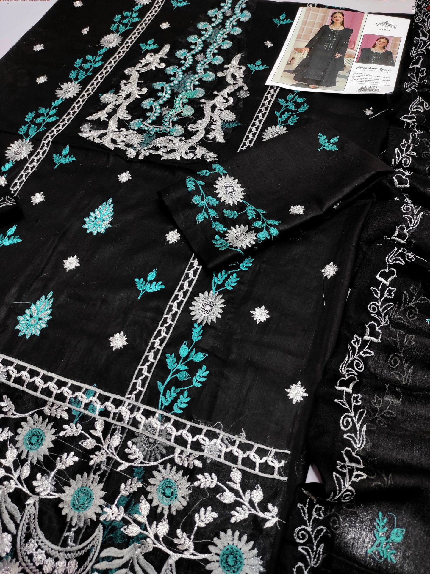 This is an unstitched lawn collection 3-piece suit with sequence embroidered front, embroidered sleeves, embroidered trouser, and a Bamber embroidered chiffon dupatta.