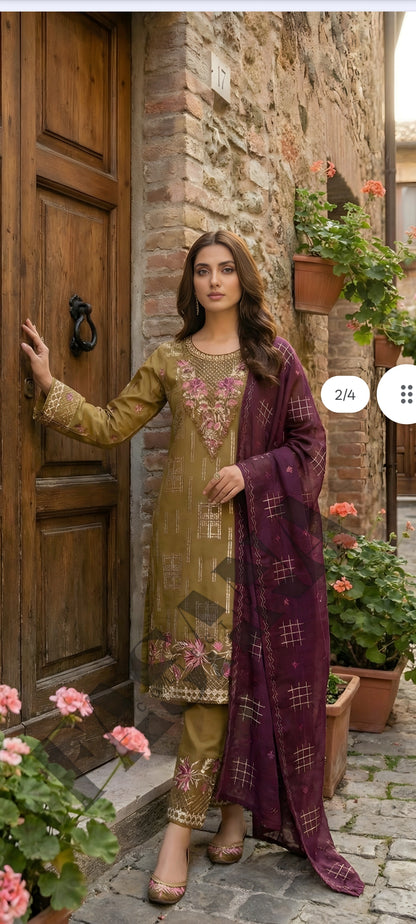 This is an unstitched lawn collection 3-piece suit with sequence embroidered front, embroidered sleeves, embroidered trouser, and a Bamber embroidered chiffon dupatta..