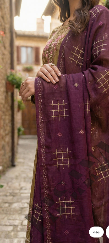 This is an unstitched lawn collection 3-piece suit with sequence embroidered front, embroidered sleeves, embroidered trouser, and a Bamber embroidered chiffon dupatta..