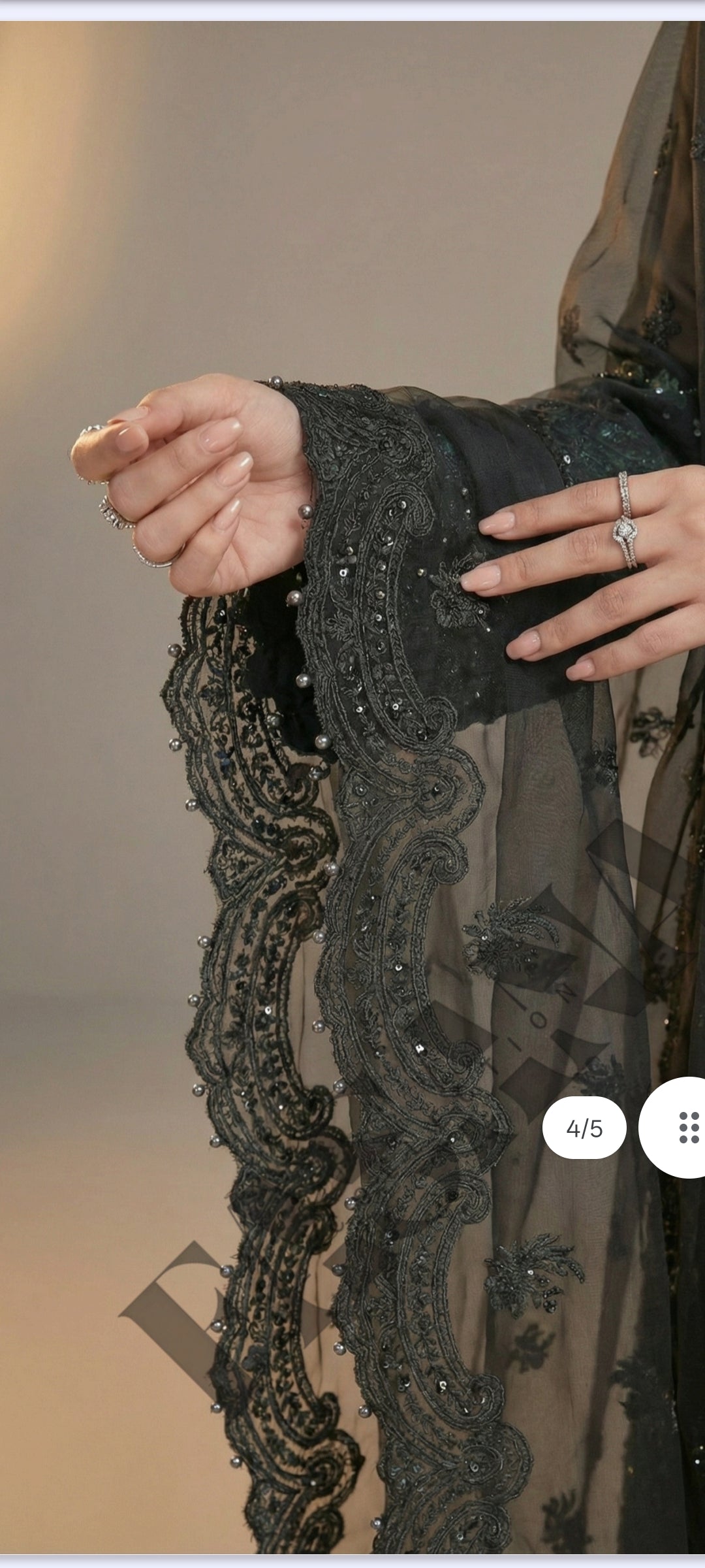 This is an unstitched lawn collection 3-piece suit with sequence embroidered front, embroidered sleeves, embroidered trouser, and a Bamber embroidered chiffon dupatta.