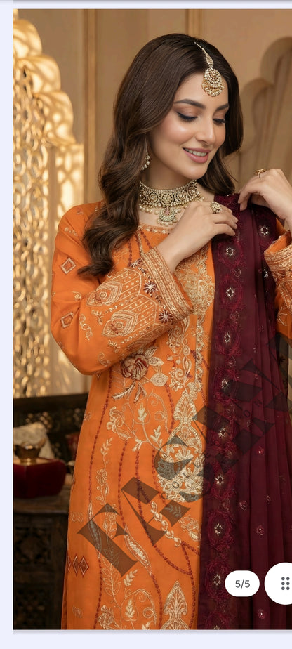 This is an unstitched lawn collection 3-piece suit with sequence embroidered front, embroidered sleeves, embroidered trouser, and a Bamber embroidered chiffon dupatta.