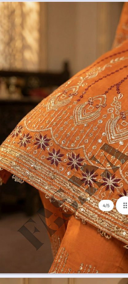 This is an unstitched lawn collection 3-piece suit with sequence embroidered front, embroidered sleeves, embroidered trouser, and a Bamber embroidered chiffon dupatta.