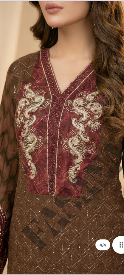 This is an unstitched lawn collection 3-piece suit with sequence embroidered front, embroidered sleeves, embroidered trouser, and a Bamber embroidered  chiffon dupatta.