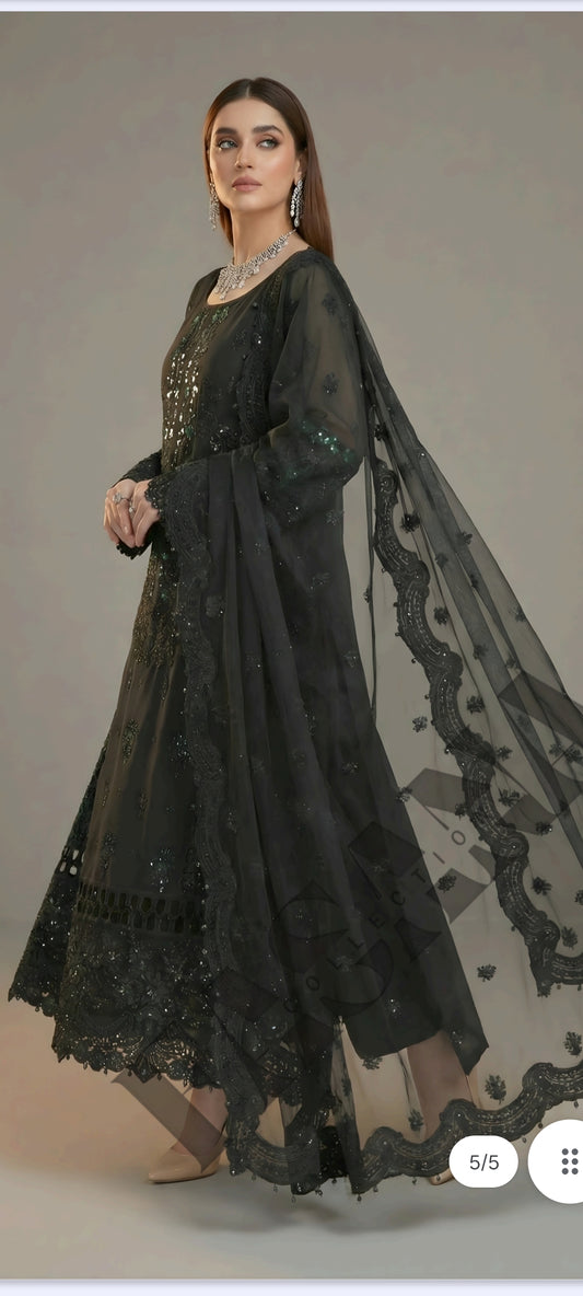 This is an unstitched lawn collection 3-piece suit with sequence embroidered front, embroidered sleeves, embroidered trouser, and a Bamber embroidered chiffon dupatta.