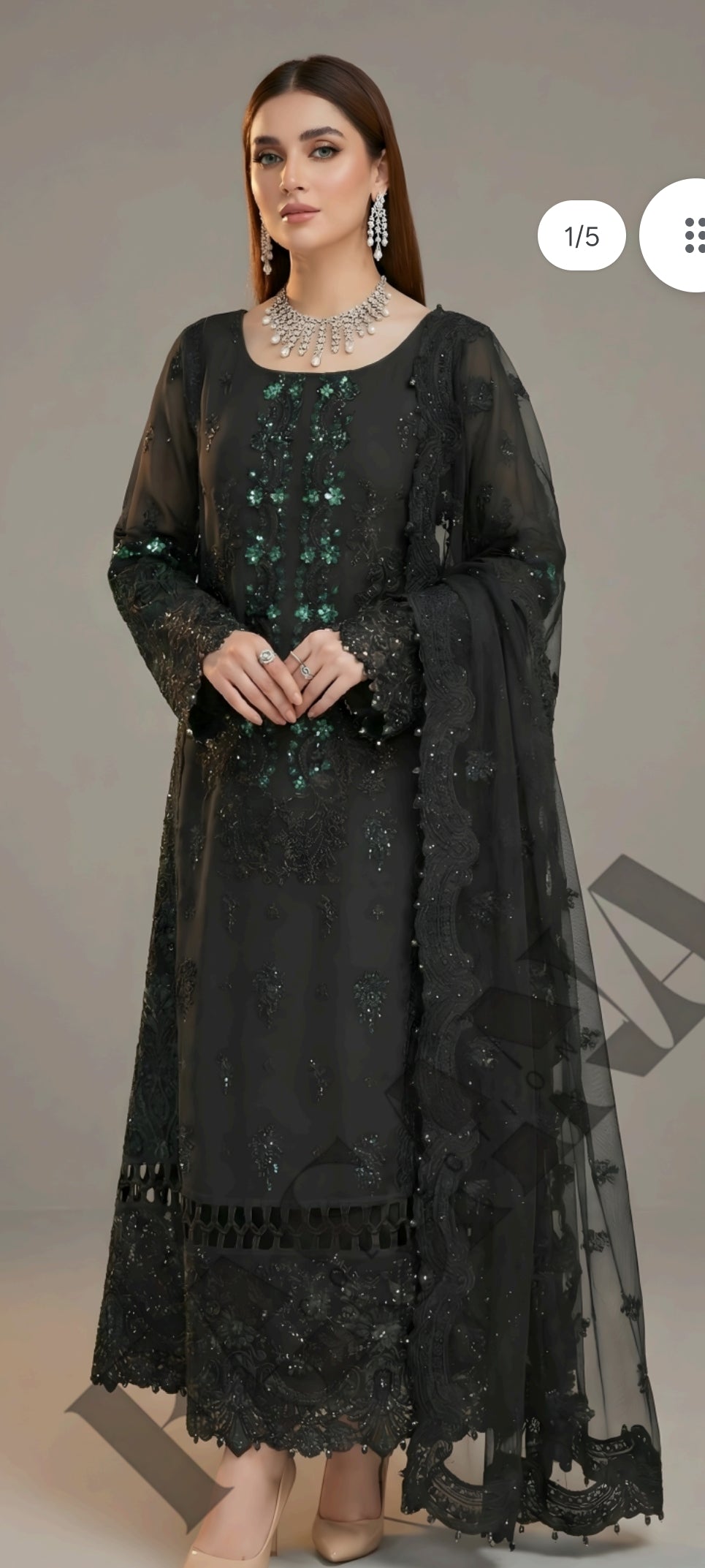 This is an unstitched lawn collection 3-piece suit with sequence embroidered front, embroidered sleeves, embroidered trouser, and a Bamber embroidered chiffon dupatta.