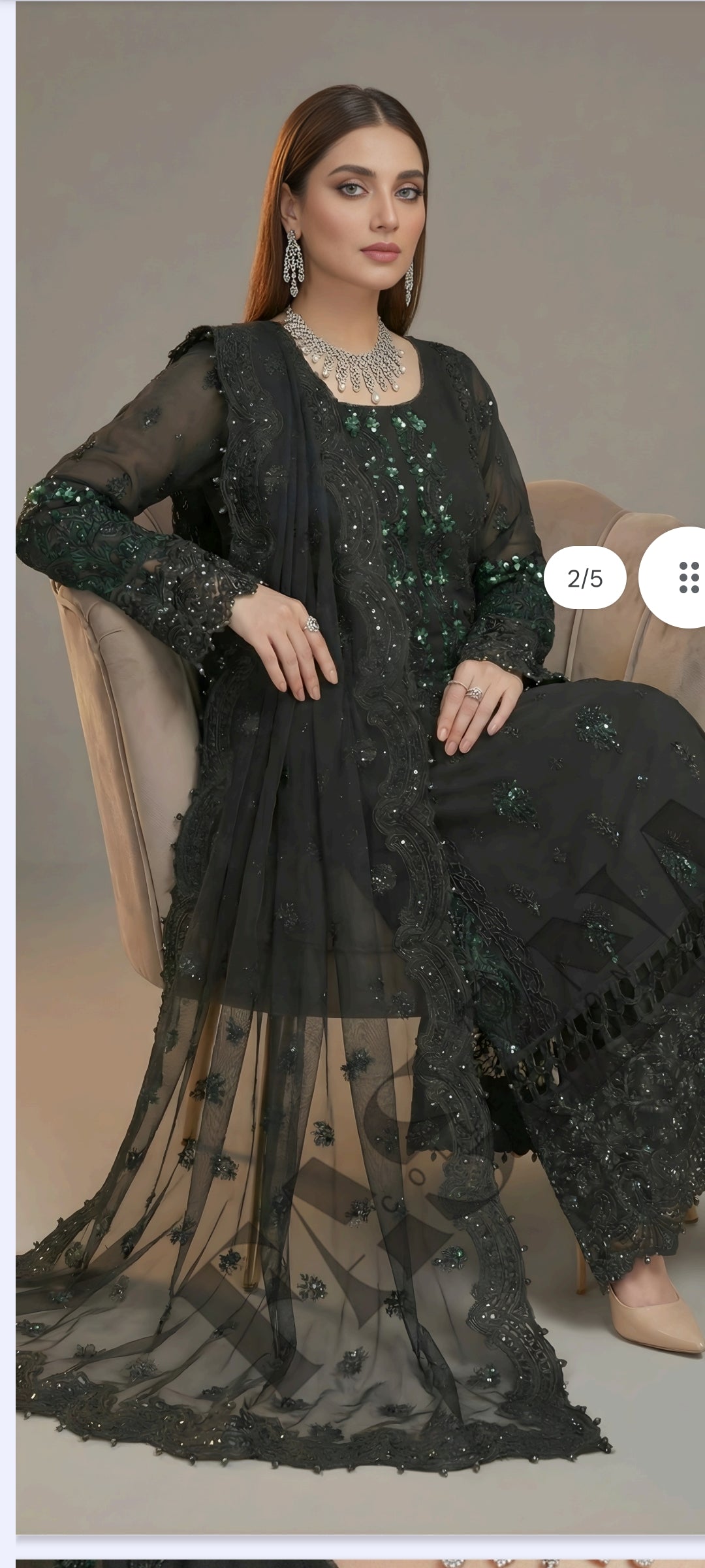 This is an unstitched lawn collection 3-piece suit with sequence embroidered front, embroidered sleeves, embroidered trouser, and a Bamber embroidered chiffon dupatta.