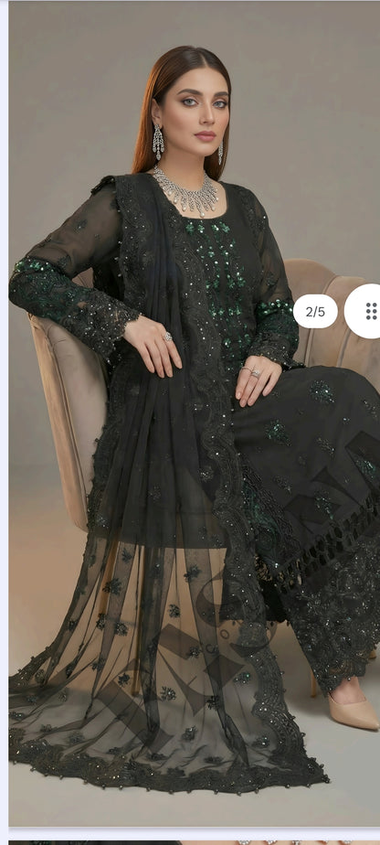 This is an unstitched lawn collection 3-piece suit with sequence embroidered front, embroidered sleeves, embroidered trouser, and a Bamber embroidered chiffon dupatta.