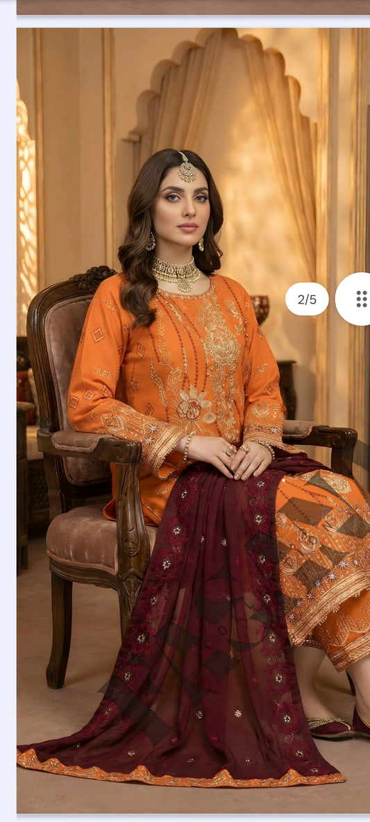 This is an unstitched lawn collection 3-piece suit with sequence embroidered front, embroidered sleeves, embroidered trouser, and a Bamber embroidered chiffon dupatta.