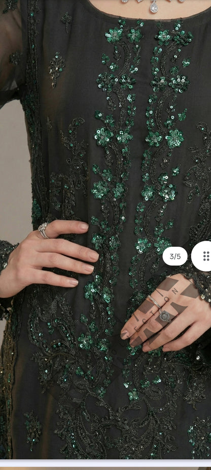This is an unstitched lawn collection 3-piece suit with sequence embroidered front, embroidered sleeves, embroidered trouser, and a Bamber embroidered chiffon dupatta.