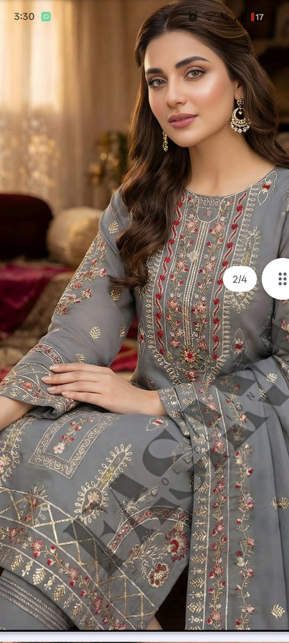 This is an unstitched lawn collection 3-piece suit with sequence embroidered front, embroidered sleeves, embroidered trouser, and a Bamber embroidered chiffon dupatta.